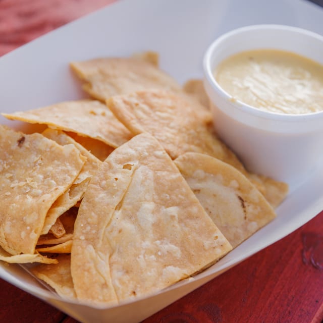 In House Tortilla Chips and Spicy Queso.